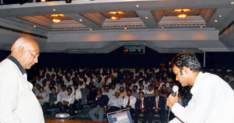 Arzoo Swabhiman Nagrik Samiti awareness seminar with speaker addressing a large audience